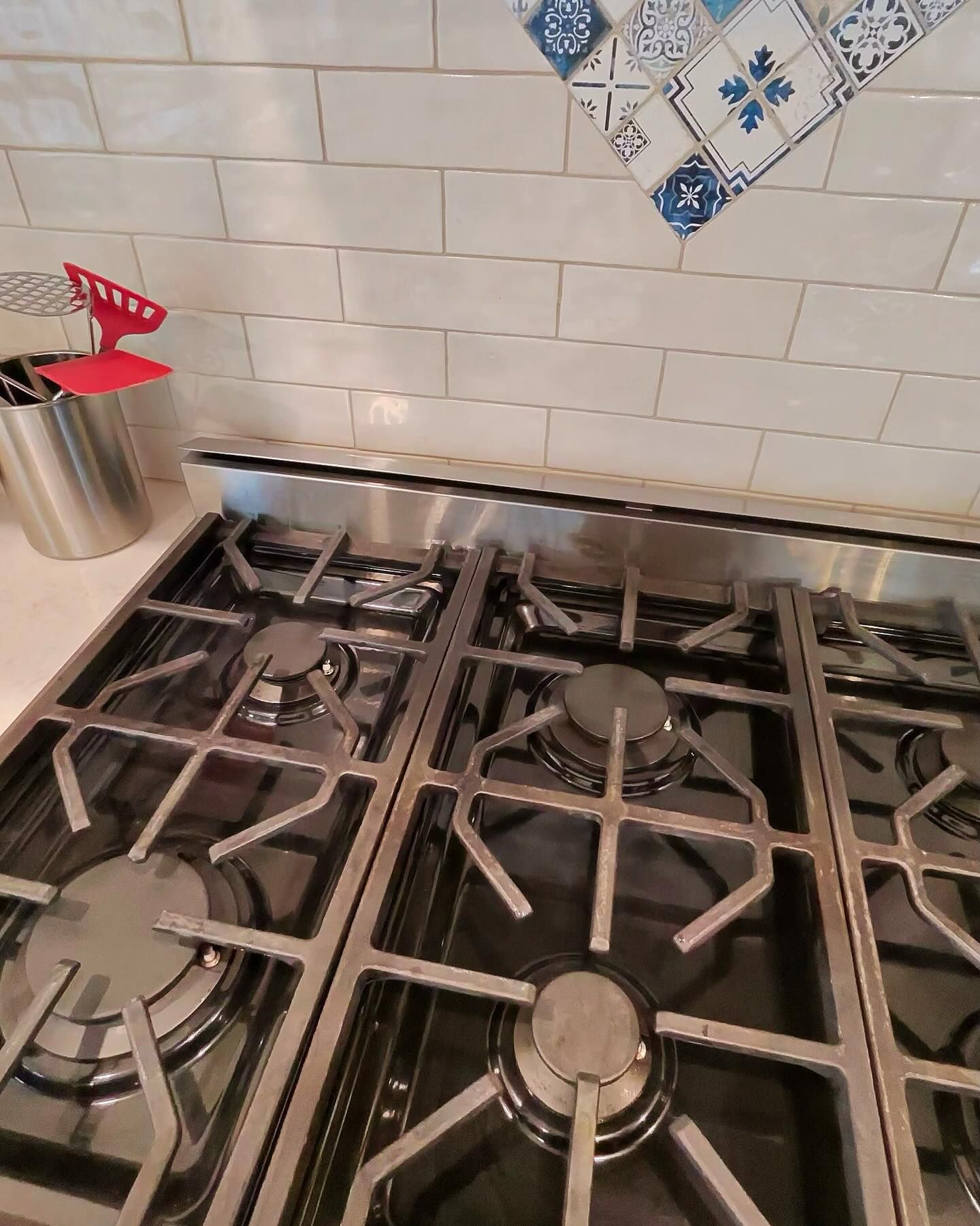 A stove top oven is sitting on top of a counter in a kitchen.