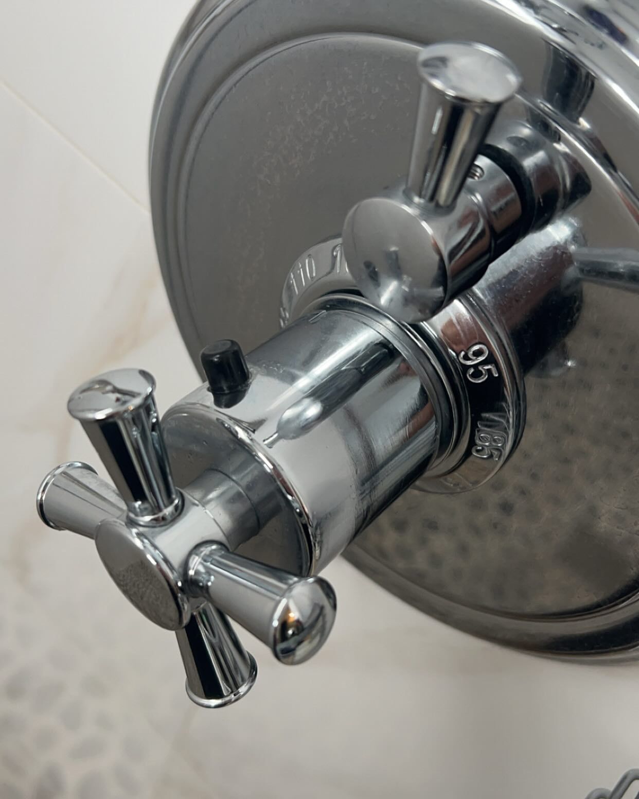 A close up of a shower head with the number 35 on it