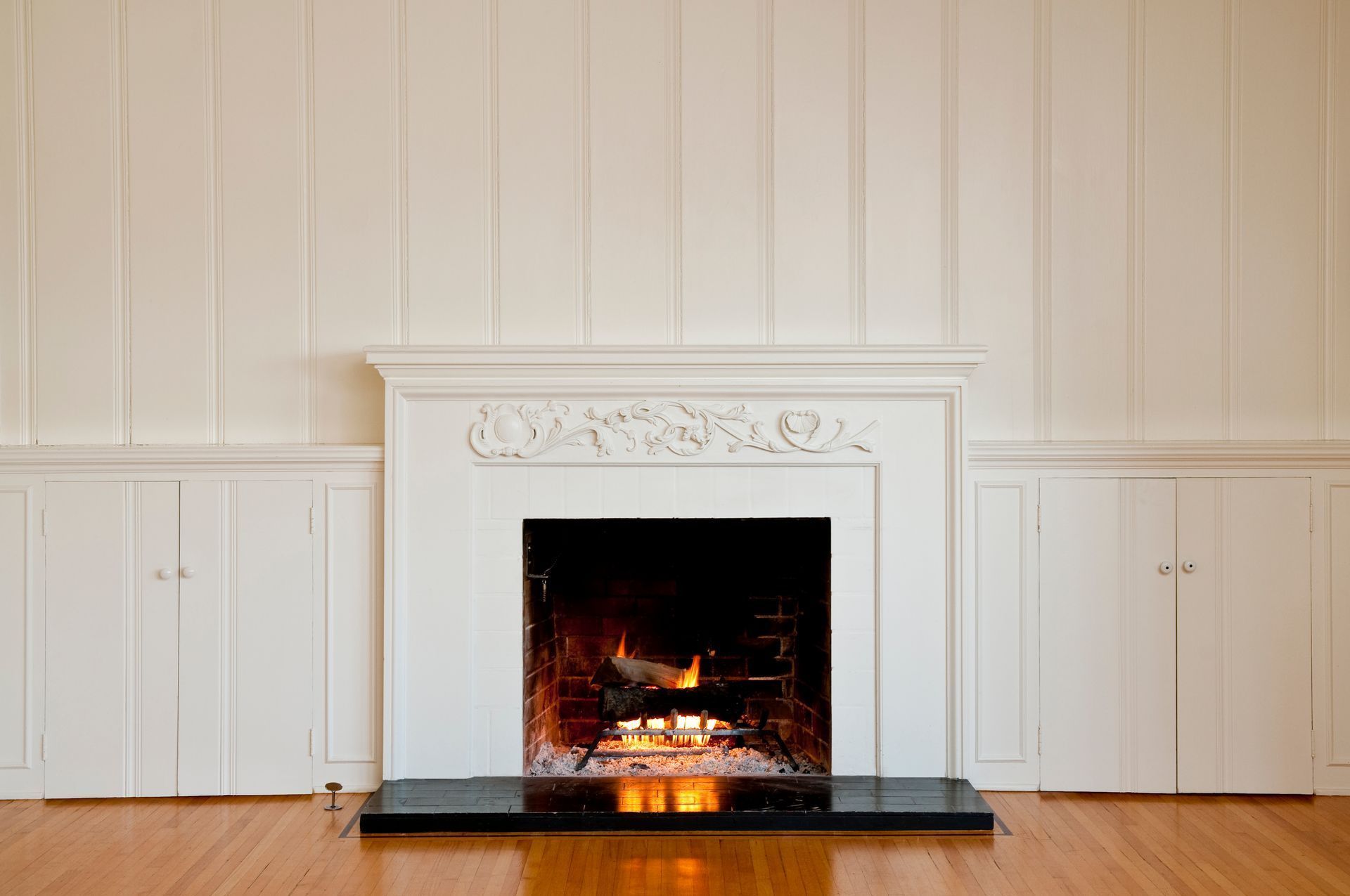 There is a fireplace in the middle of the room.