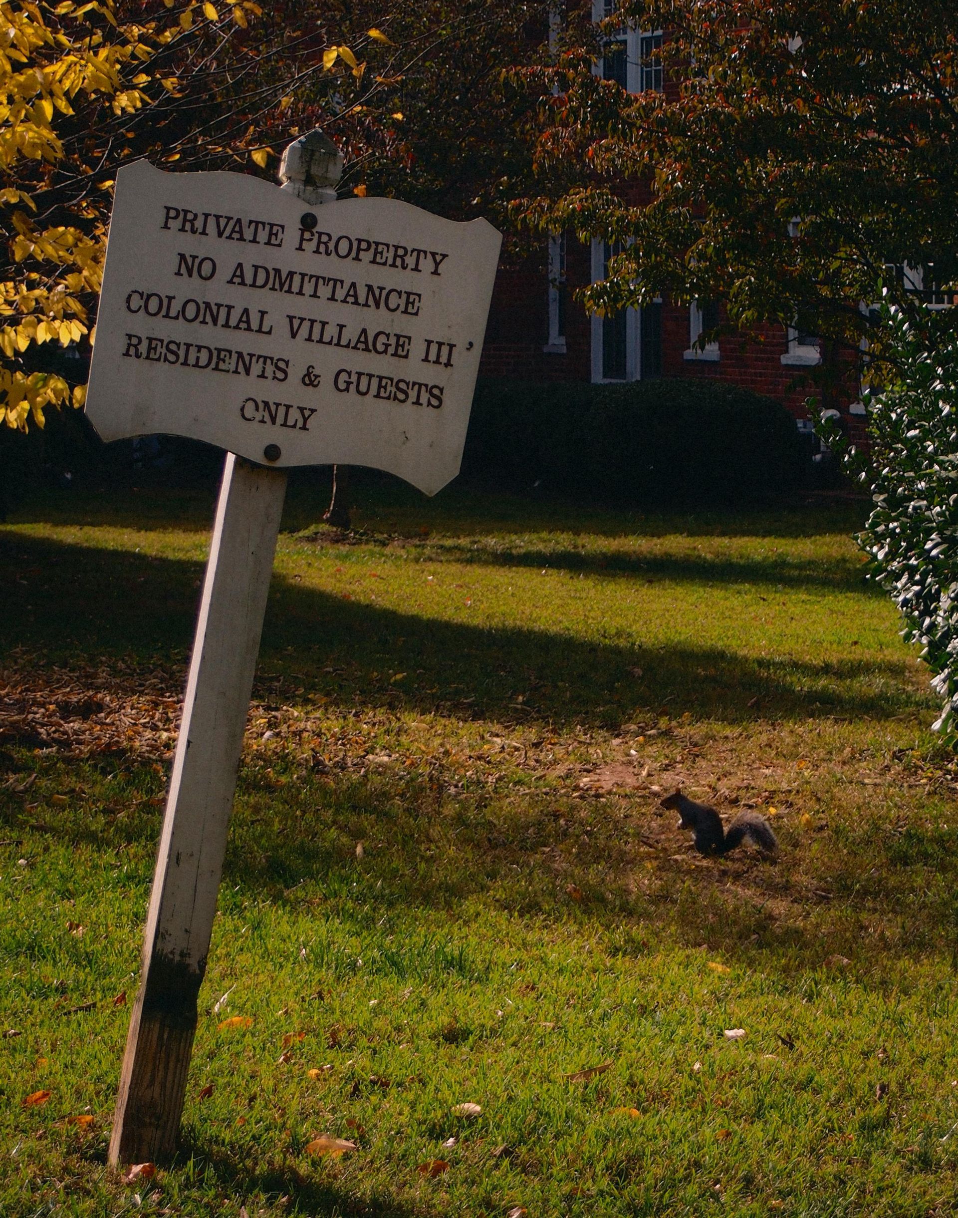 A sign that says private property no admittance colonial village iii residents & guests only