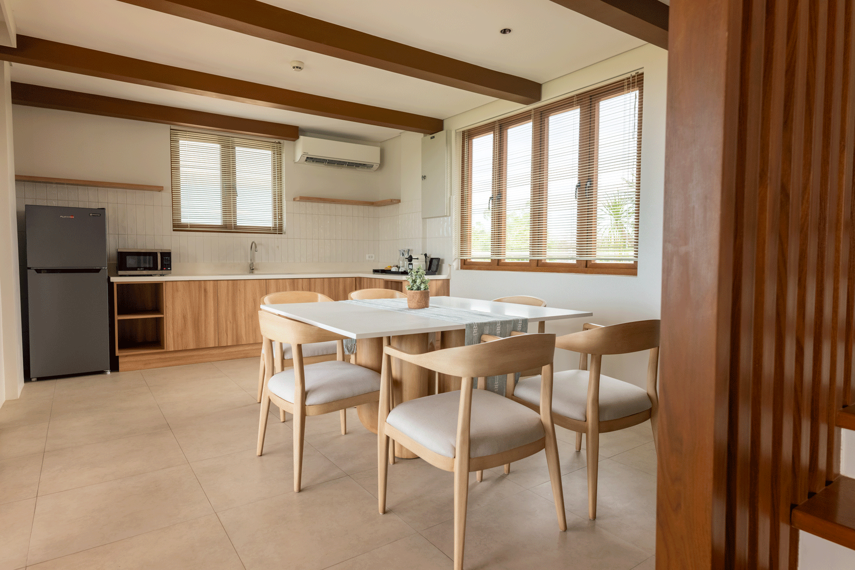 Bright open-plan kitchen and dining area at Harvest Hotel Cabanatuan