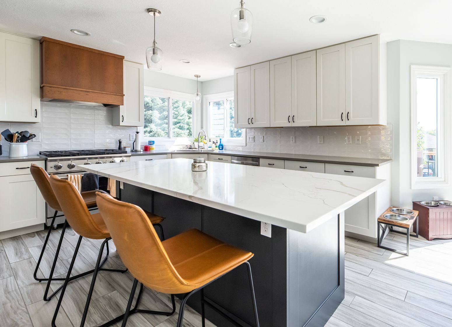 A kitchen with a large island in the middle of the room.