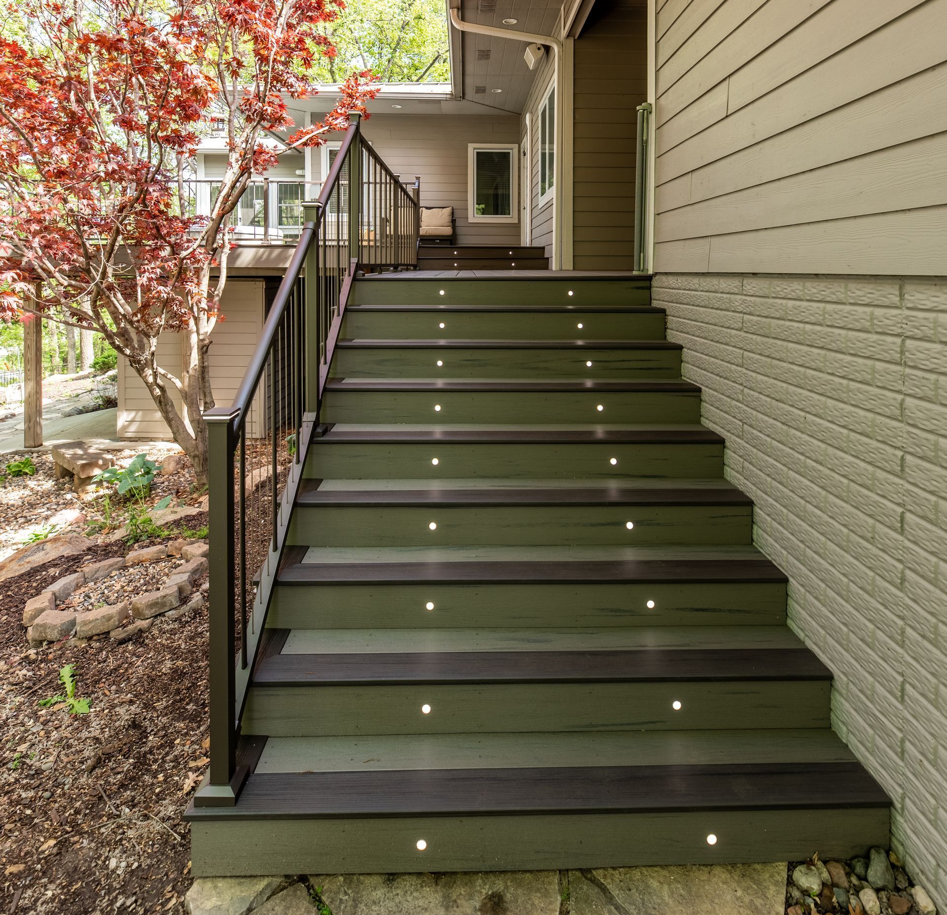 A set of stairs leading up to the front of a house.
