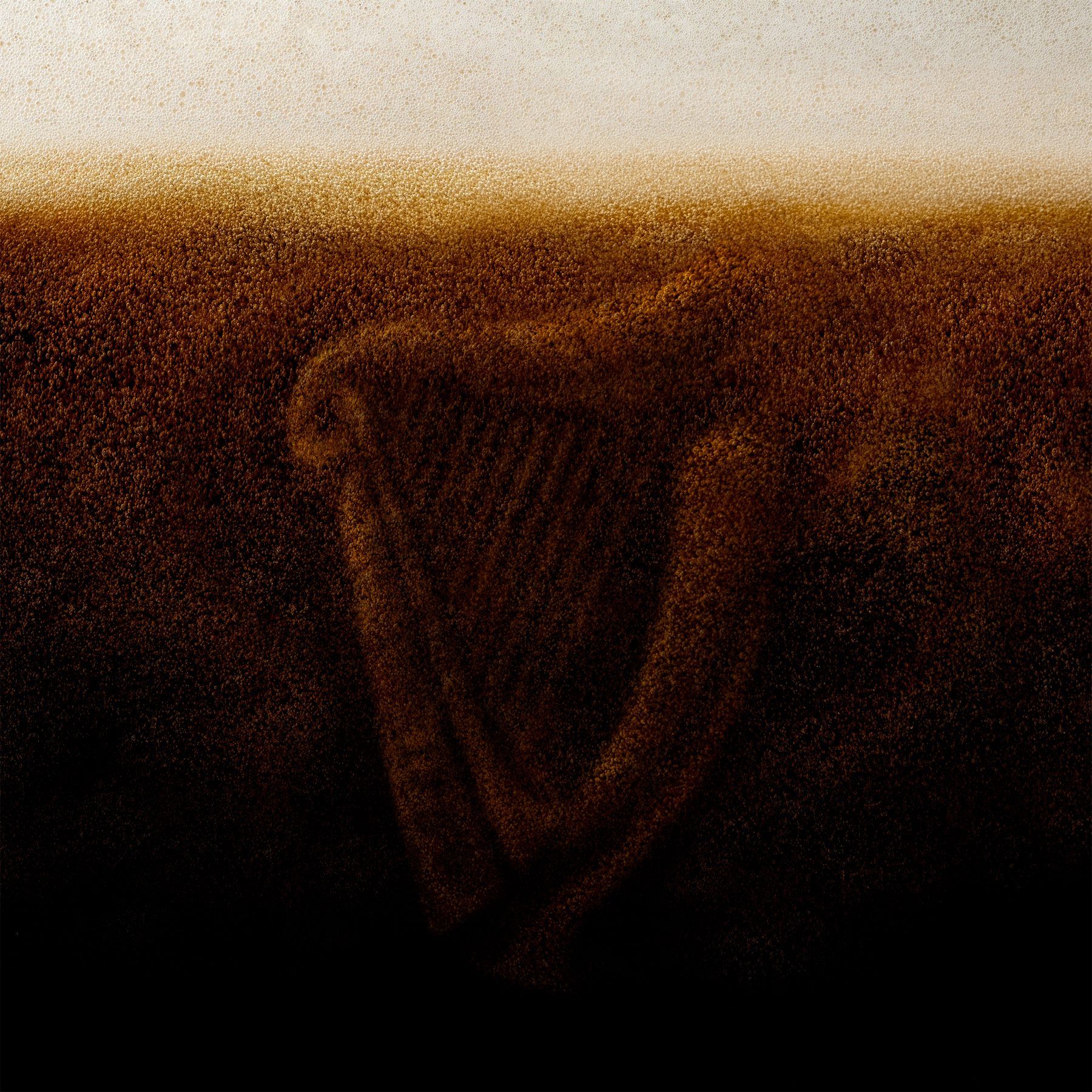 Guinness pint glass mid-pour — high-speed commercial beer photography, London studio