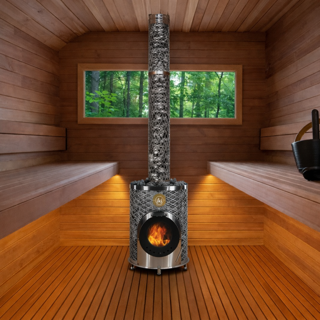 Wood-paneled sauna with benches, a central stove and chimney, and a forest view through the window
