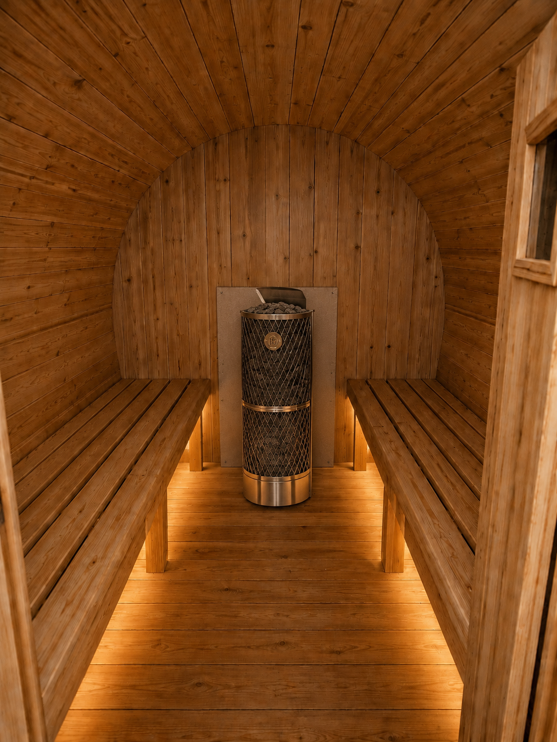 Barrel sauna with IKI heater, inside a Uforia Sauna