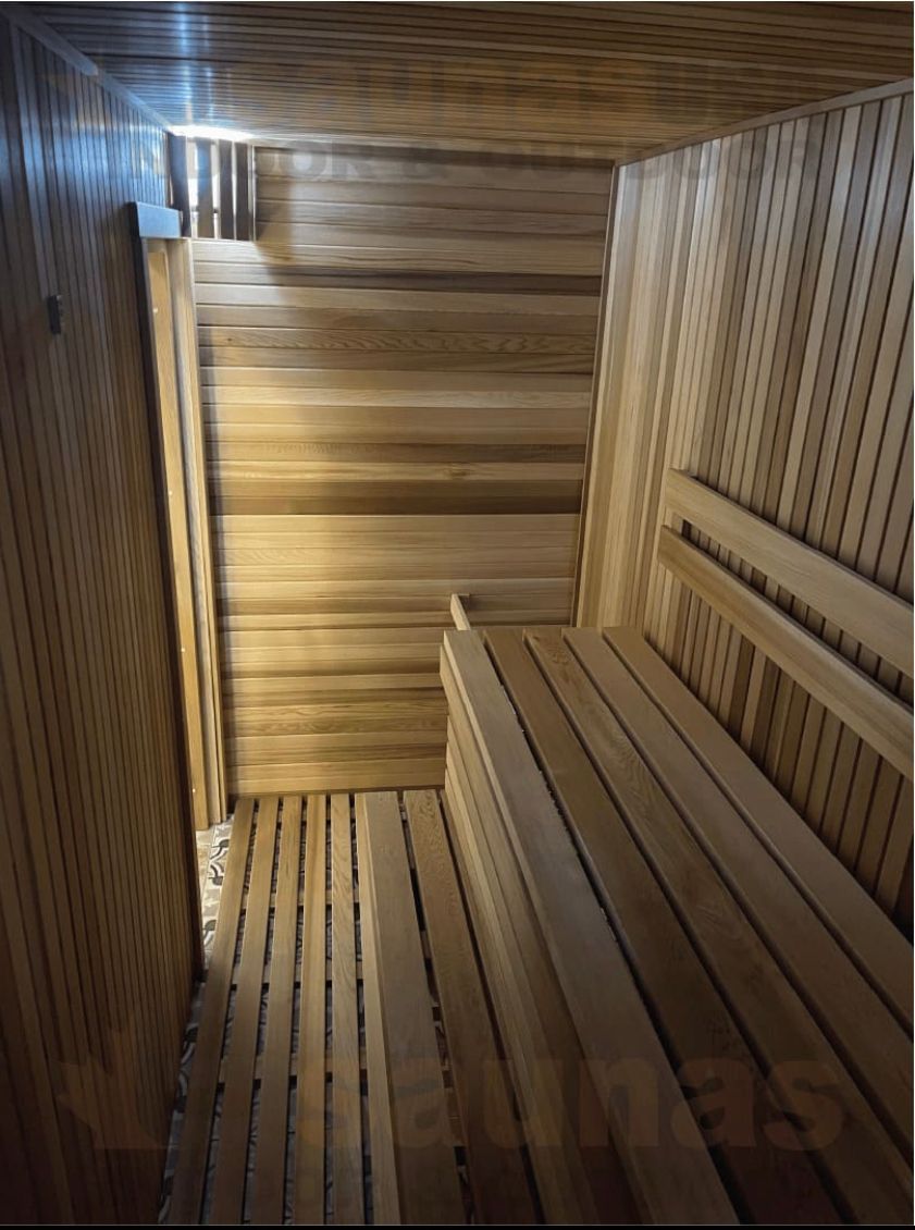 Wooden stairwell with striped slatted walls and warm light