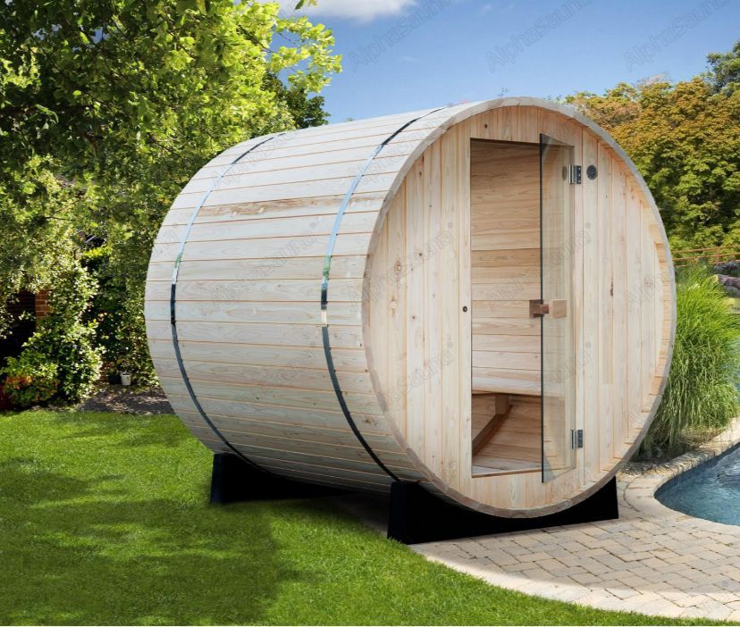 Barrel-shaped outdoor sauna made of light wood in a garden, with a curved door and green lawn.