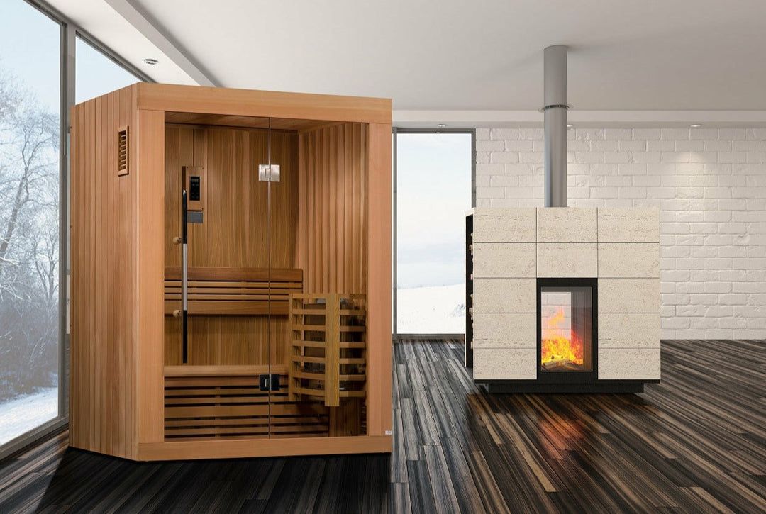 Wood-paneled sauna with benches beside a modern fireplace in a bright room