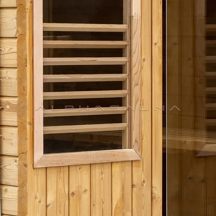 Wooden sauna wall with a small louvered window and glass door