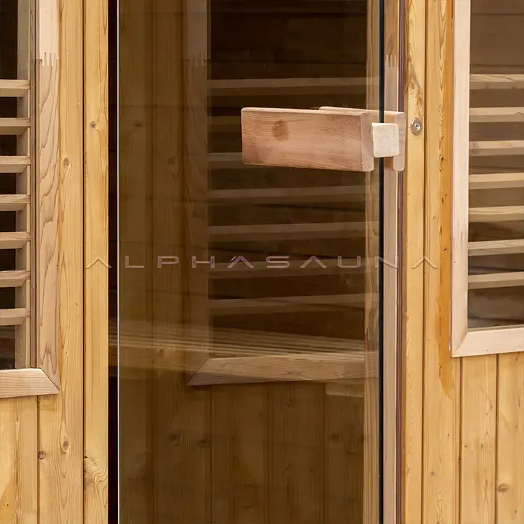 Wooden sauna door with glass panel and small wooden handle on a timber cabin exterior