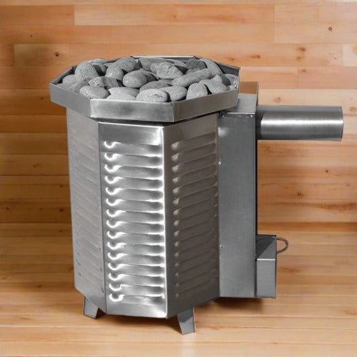 Stainless steel wood pellet stove with rounded stones on top and a side vent, against a wood wall