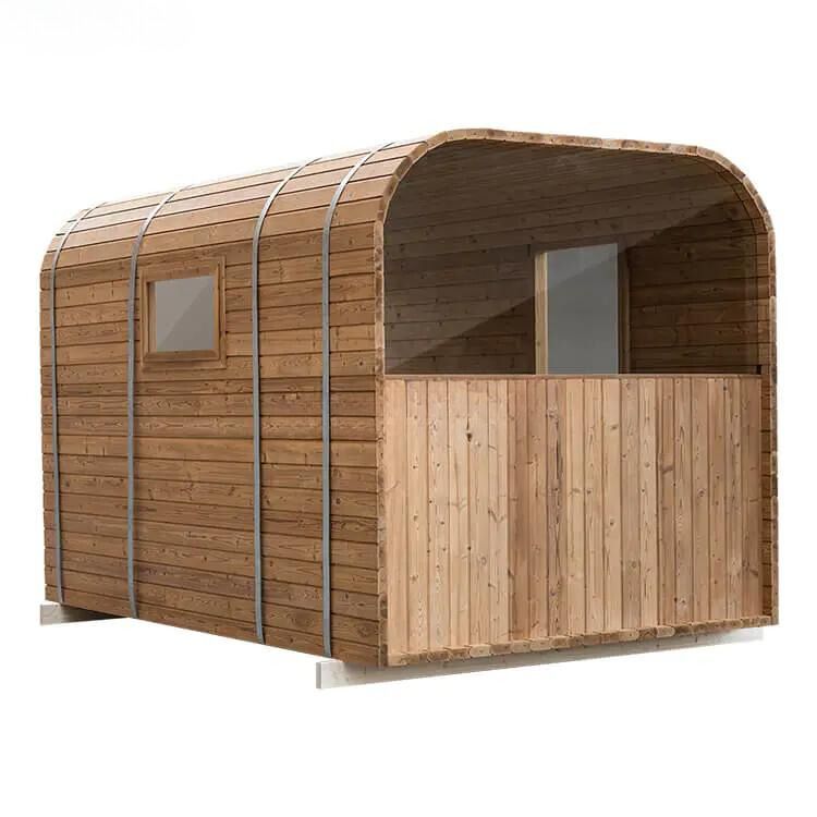 Wooden tiny house with curved roof and front porch, shown on a white background
