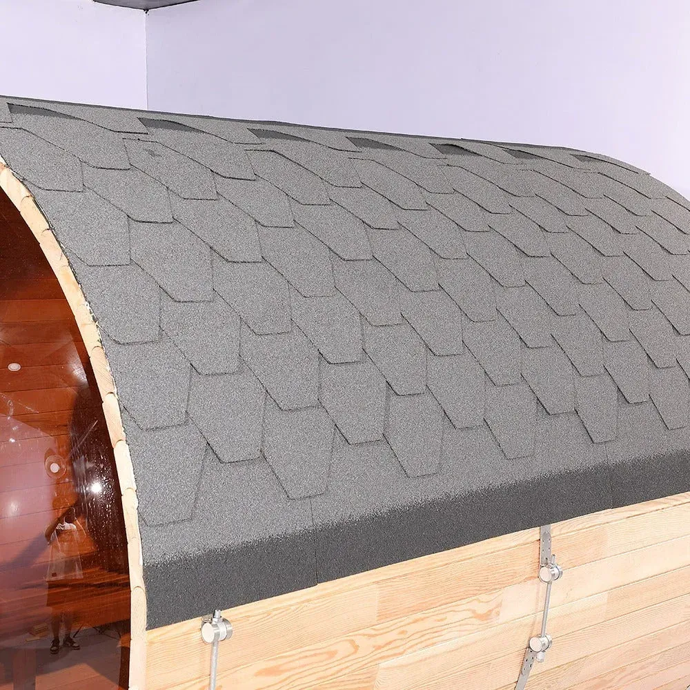 Gray shingled curved roof on a wooden chest or shed interior, with metal hinges visible