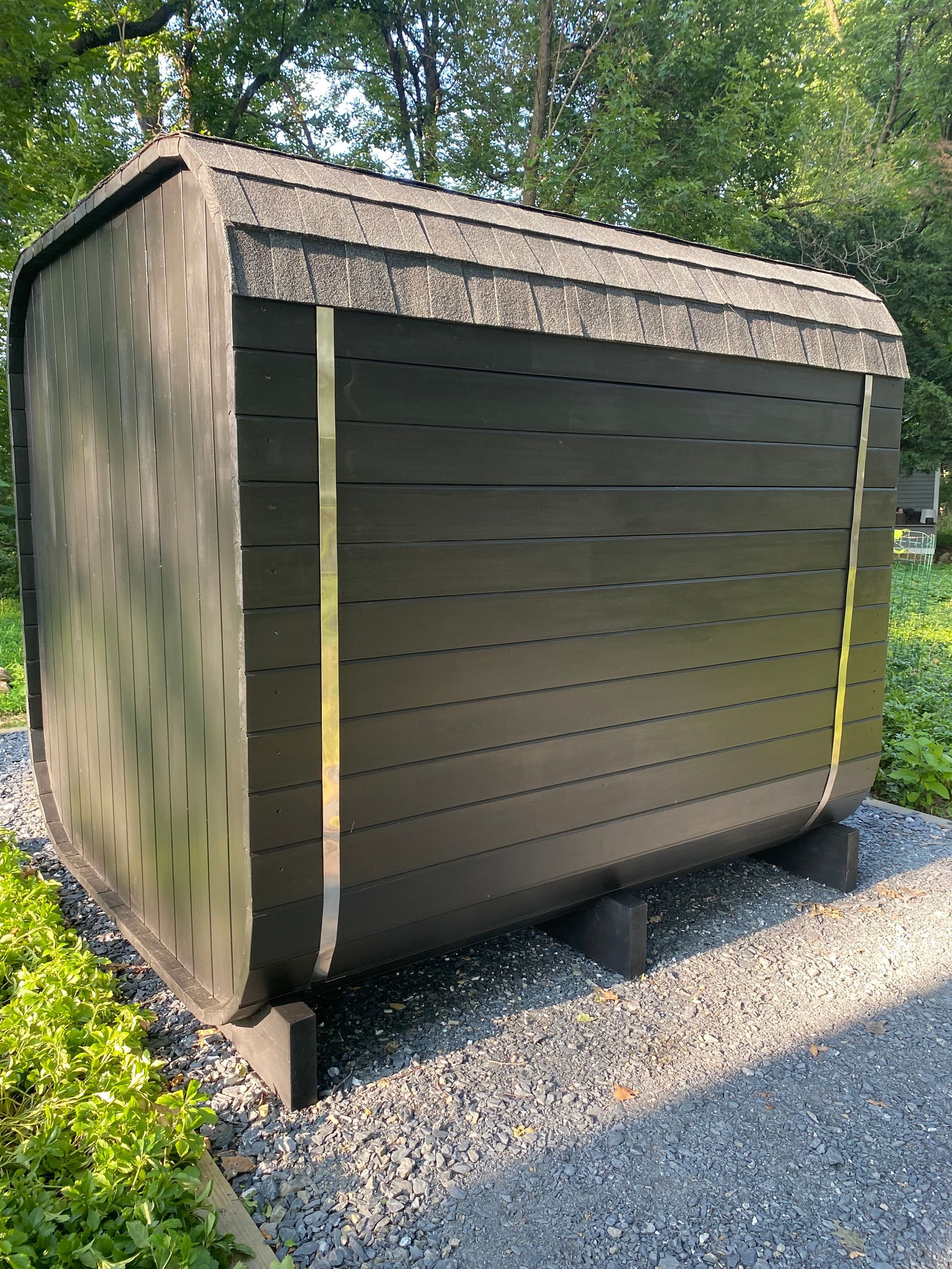 Uforia Sauna outdoor 10 person custom sauna in a garden setting