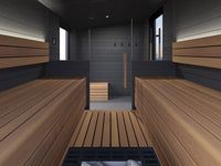 Modern sauna interior with wooden benches, slatted floor, and dark walls
