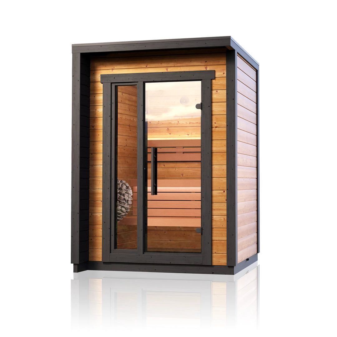 Compact modern wooden sauna cabin with glass door and sunset-lit interior