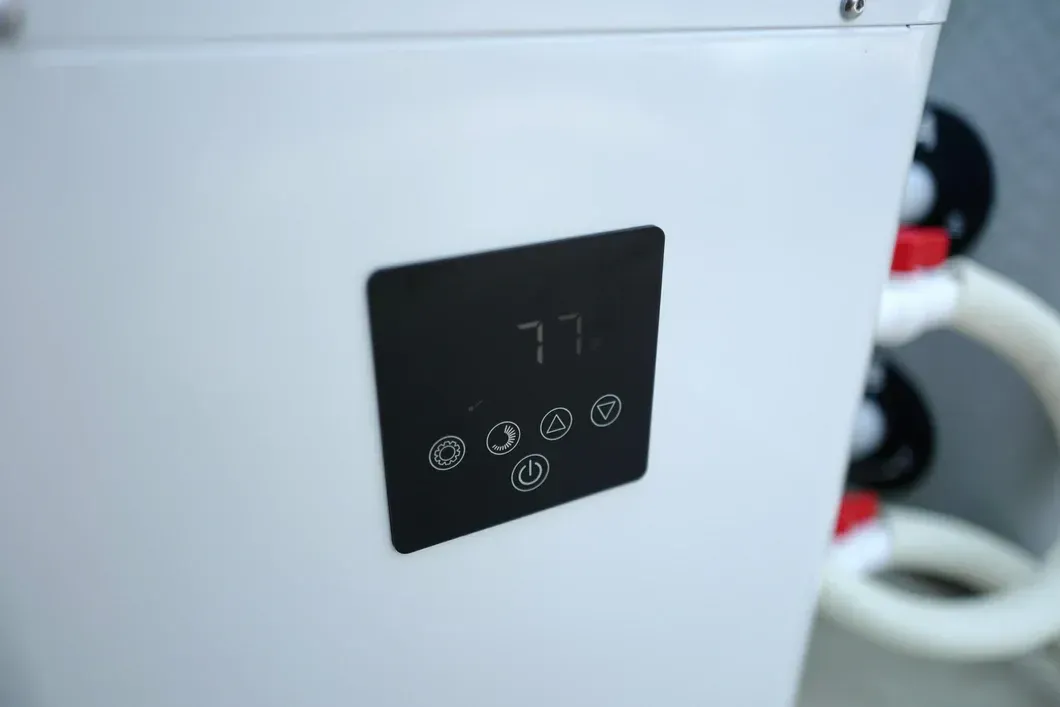Black control panel with digital display on a white appliance panel
