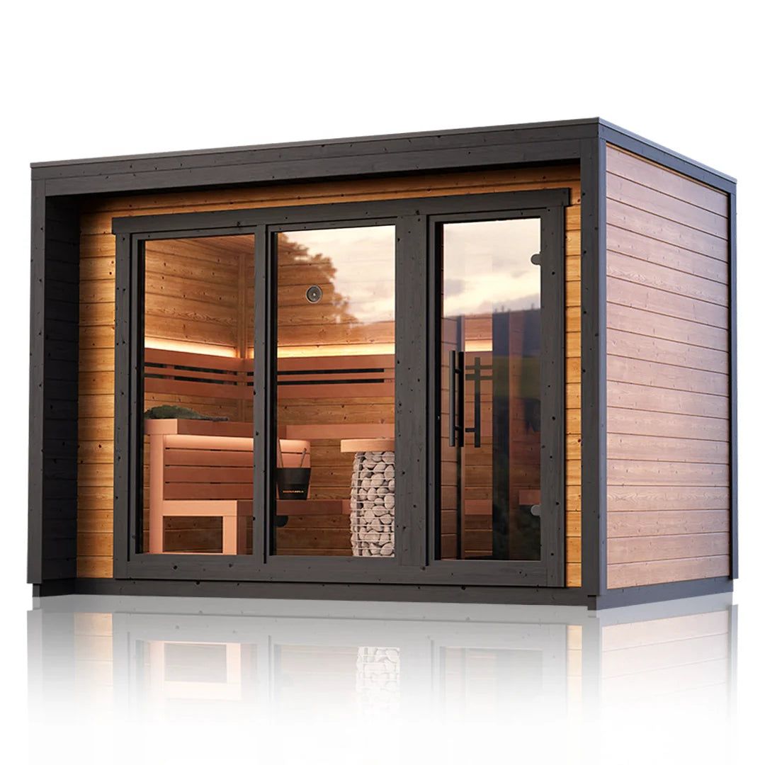 Modern tiny house with large glass front and warm interior lighting