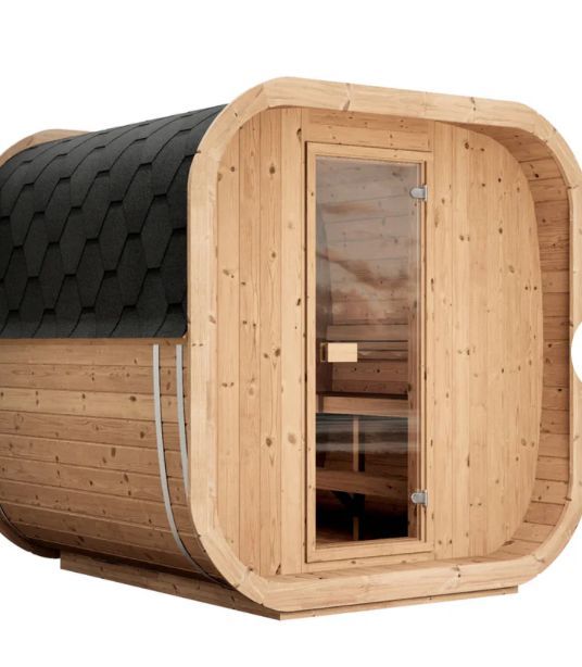 Compact wooden barrel sauna with black shingled roof and glass door