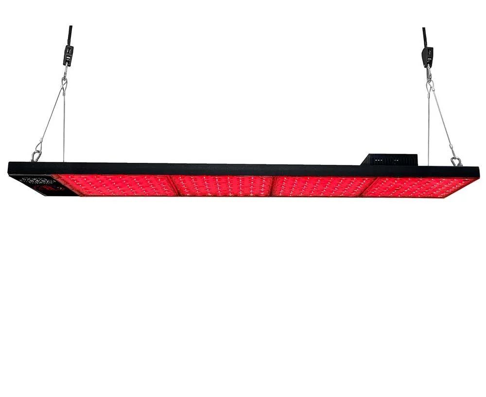 Red LED grow light panel hanging by chains on a white background