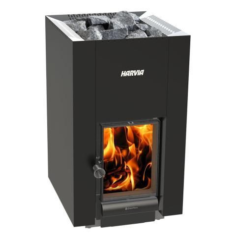 Black Harvia wood stove with a glass door and visible flames, topped with sauna stones