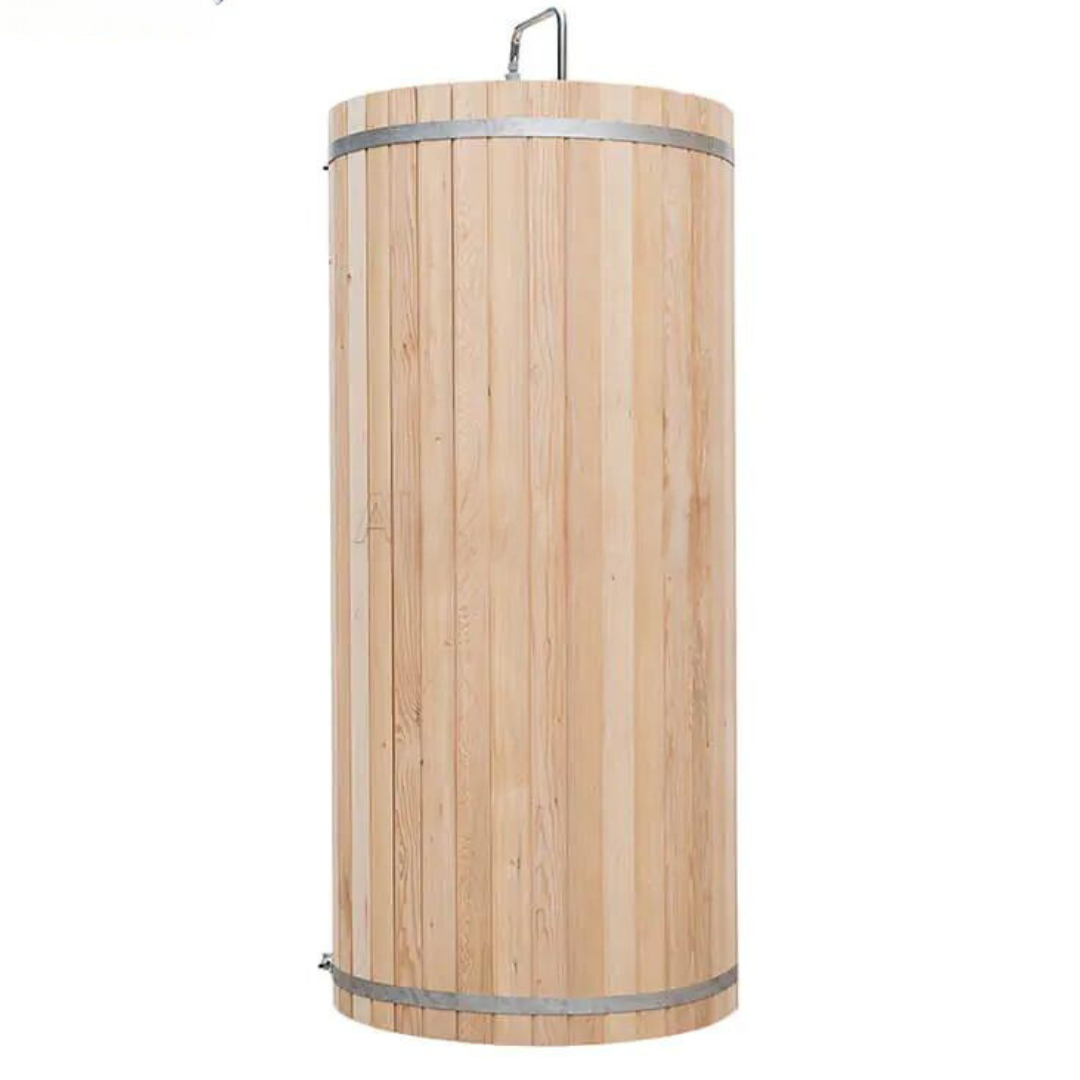 Cylindrical wooden outdoor shower with a small step platform and metal bands