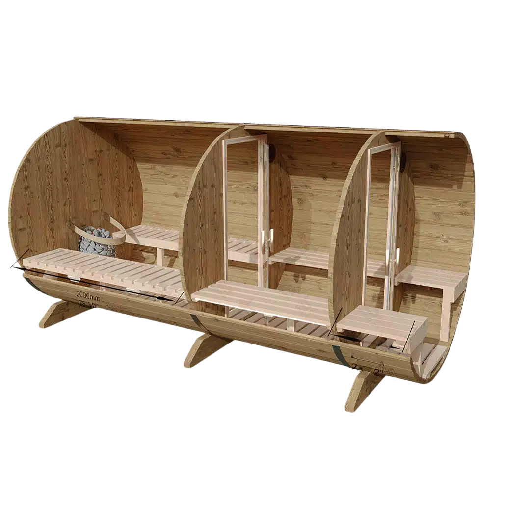 A compact wooden barrel cabin on a deck in a forest setting, with a small porch and stairs.