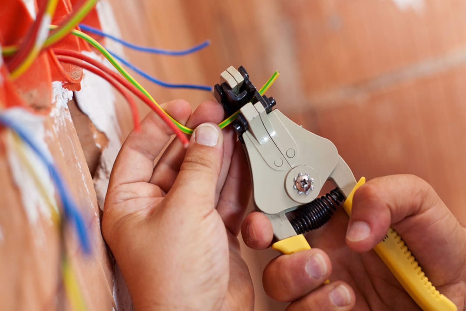 Splicing Wires - Los Angeles, CA - Gomez Electric Inc A professional performing an electrical panel upgrade in Lynwood, CA