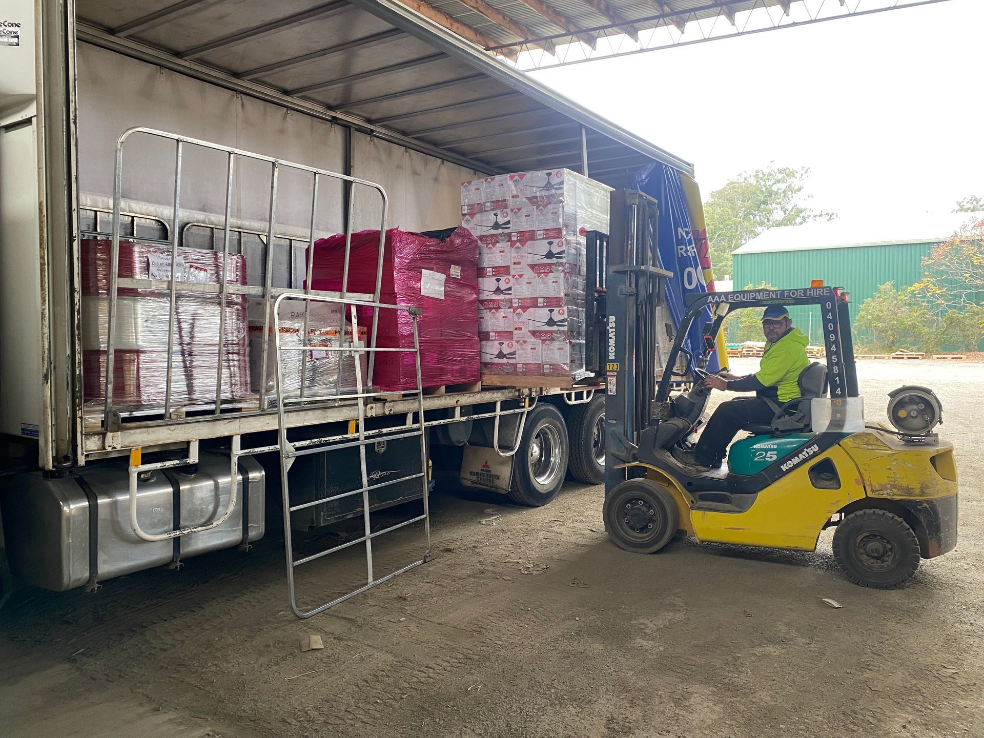 Man On Forklift Moving Pallets — Professional Transport in Taree South NSW