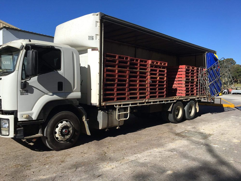 Truck Loaded With Pallets — Professional Transport in Port Macquarie, NSW