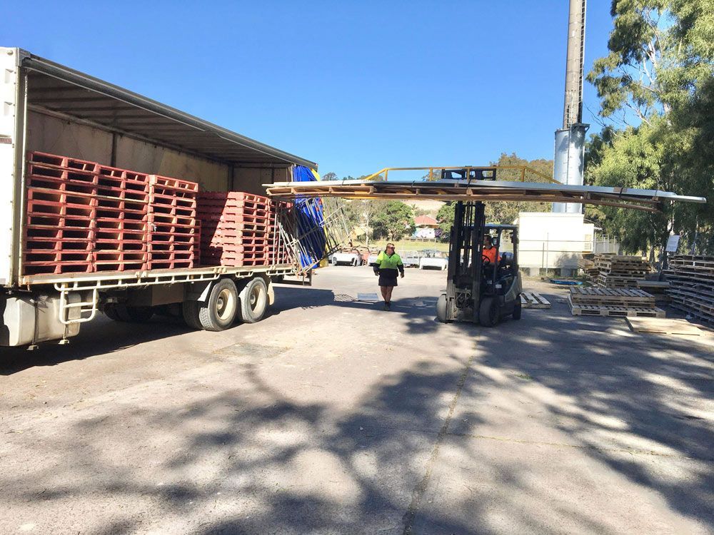 Forklift And Truck Loaded With Pallet — Professional Transport in Taree South NSW