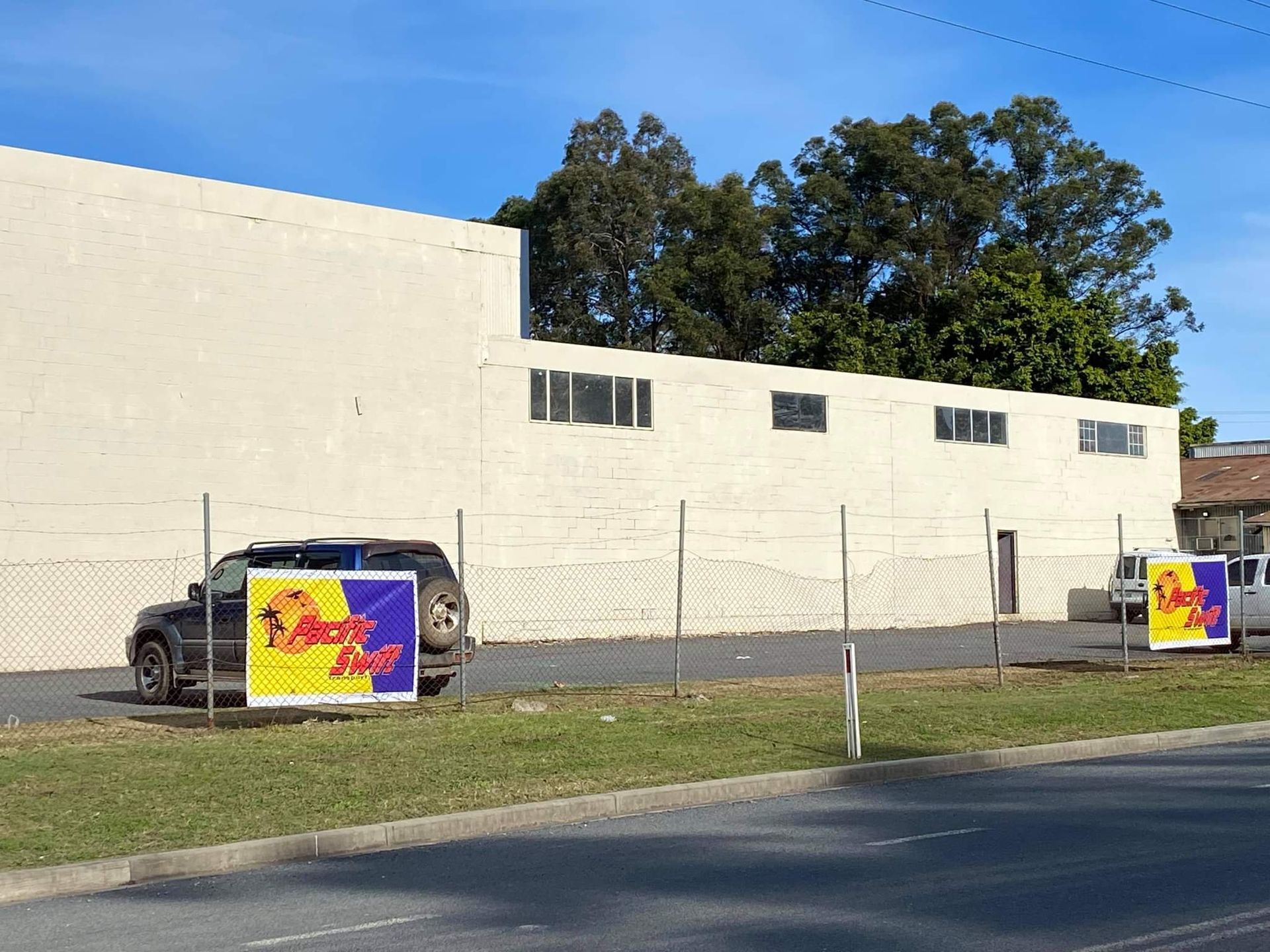 Storage Warehouse With Business Logo — Professional Transport in Forster, NSW