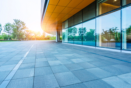 Modern office building exterior with pristine windows after expert business glass maintenance service.