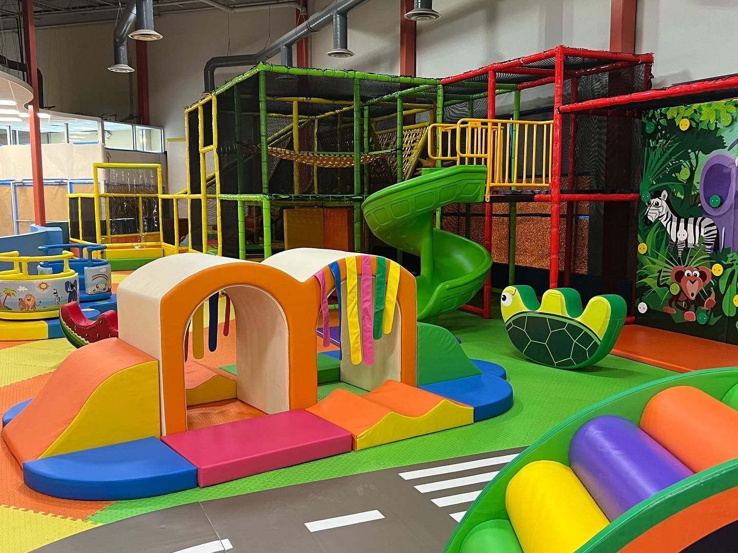 There is a slide in the middle of the playground.