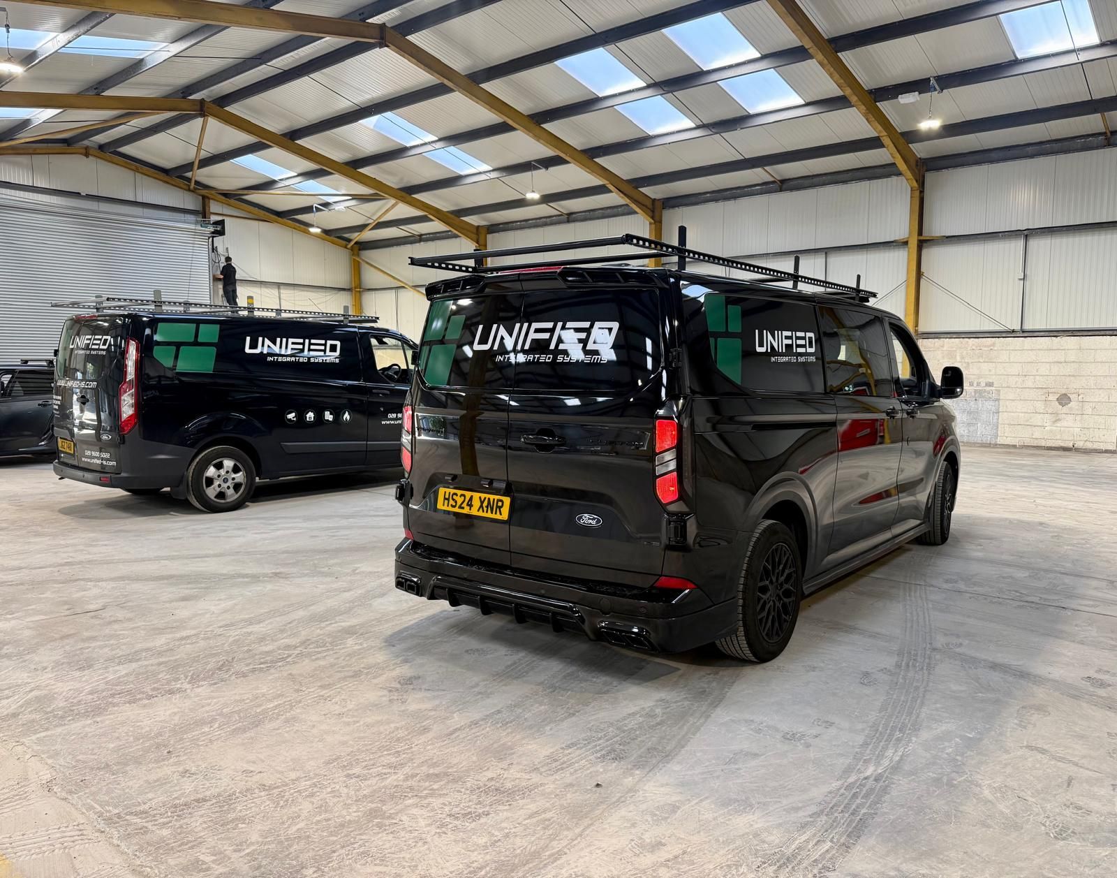 Two Unified work vans