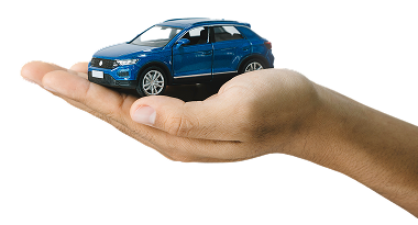 A blue toy SUV resting on an open human hand against a white background | Clark's Tire & Automotive