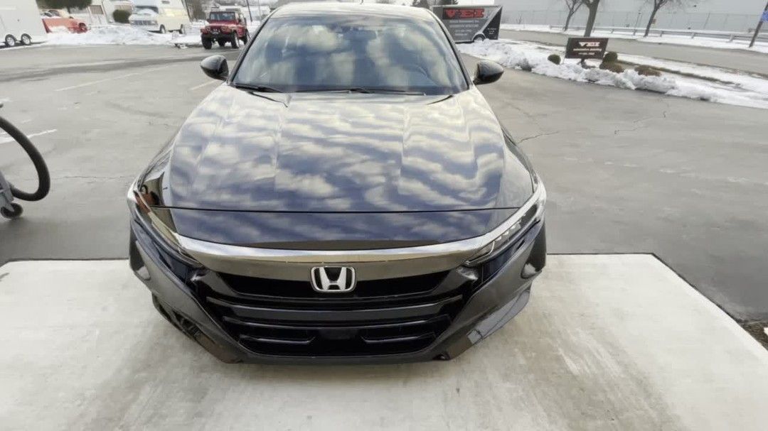 a ceramic-coated vehicle outside a detailing shop