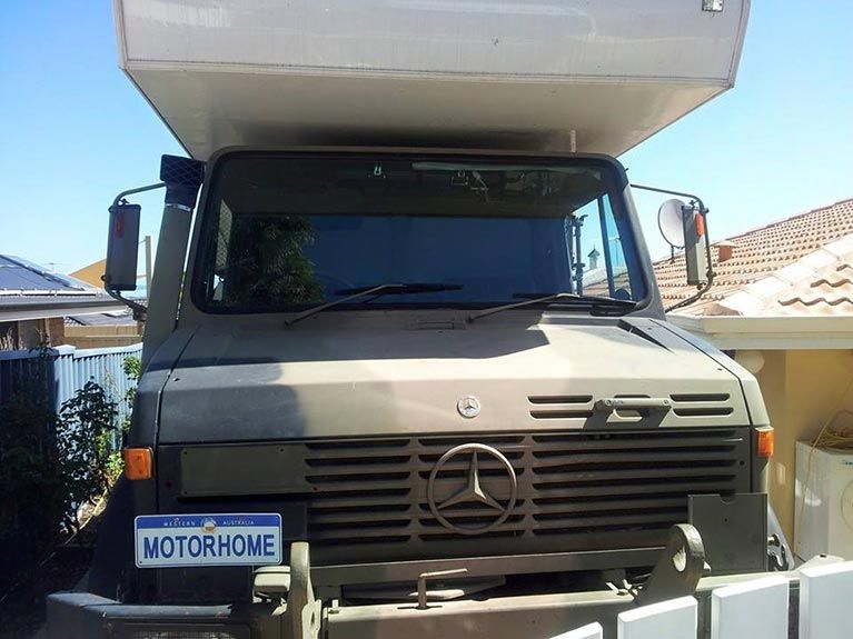 A mercedes truck with a license plate that says motorhome