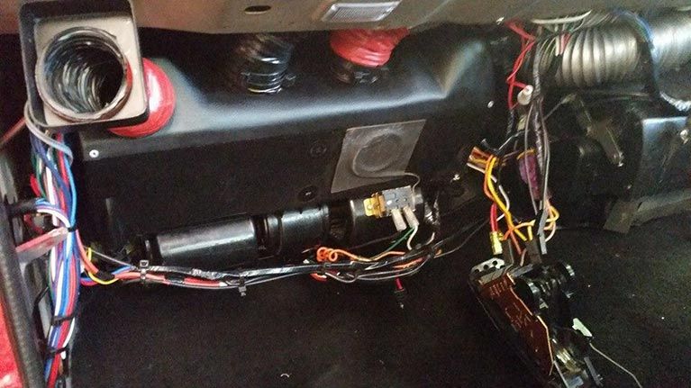 A car with a lot of wires coming out of it