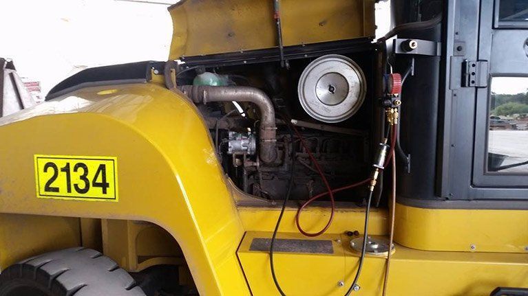 A yellow truck with the number 2334 on the side of it.