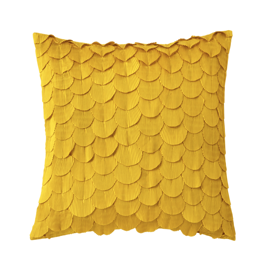 Un oreiller jaune avec un motif d'écailles de poisson dessus