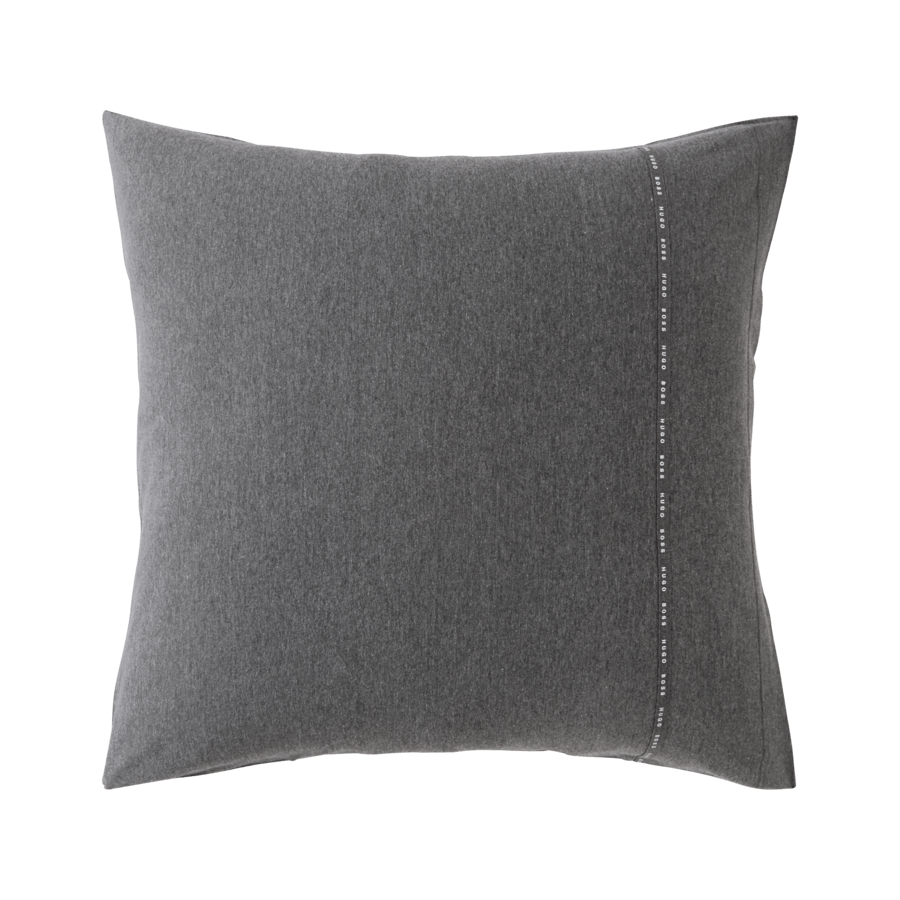 Un oreiller gris avec des coutures blanches sur le côté