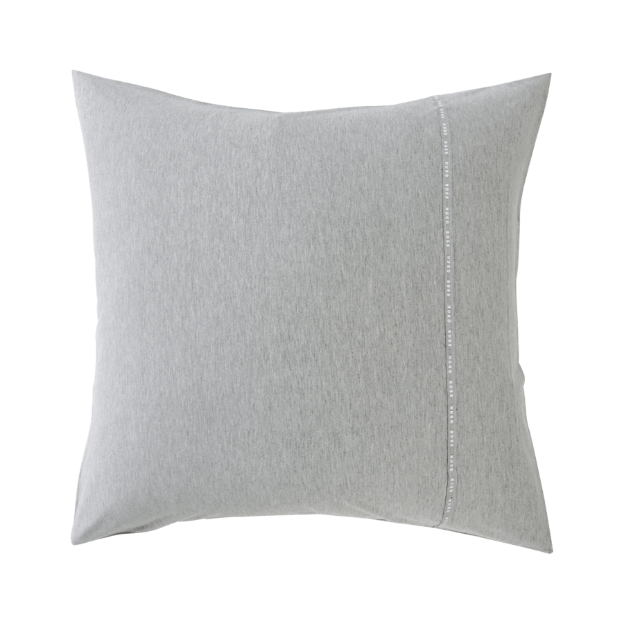 Un oreiller gris avec une couture blanche sur le côté