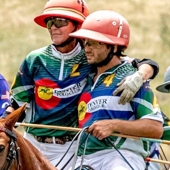 A man wearing a shirt that says denver polo club