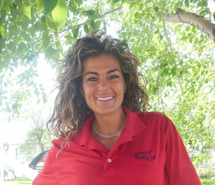 A woman wearing a red shirt that says united states of america