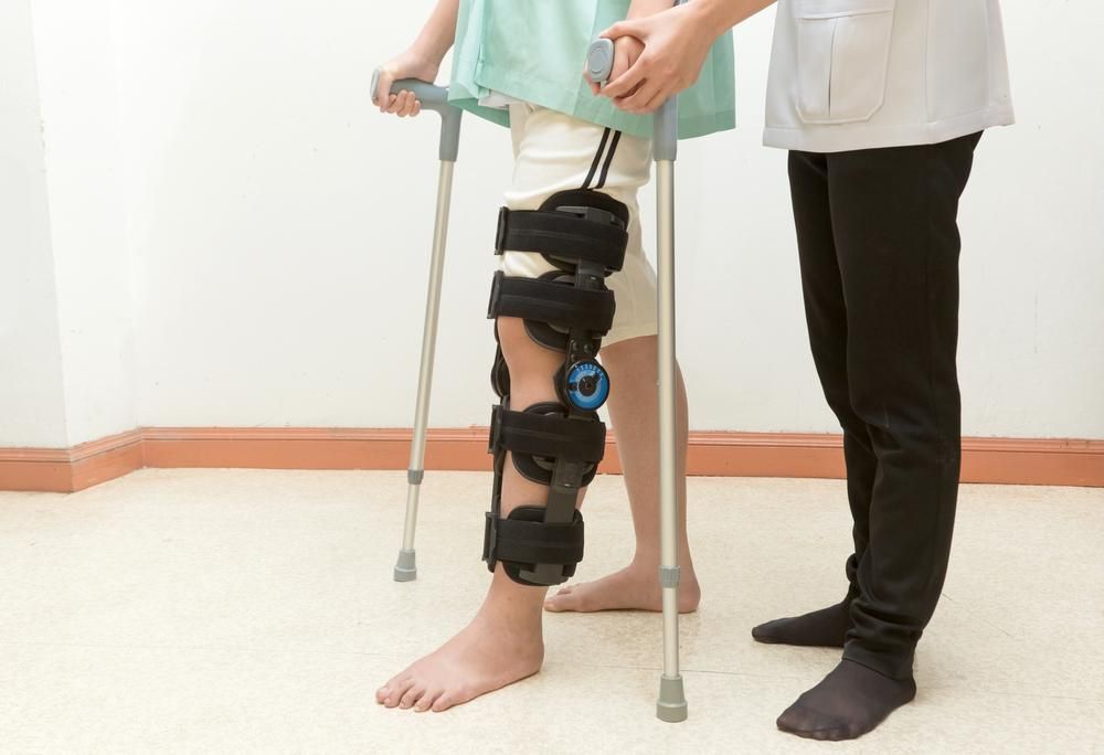 A Person with A Broken Leg Is Using Crutches to Walk — St Vincents Physiotherapy & Day Rehab in East Lismore, NSW
