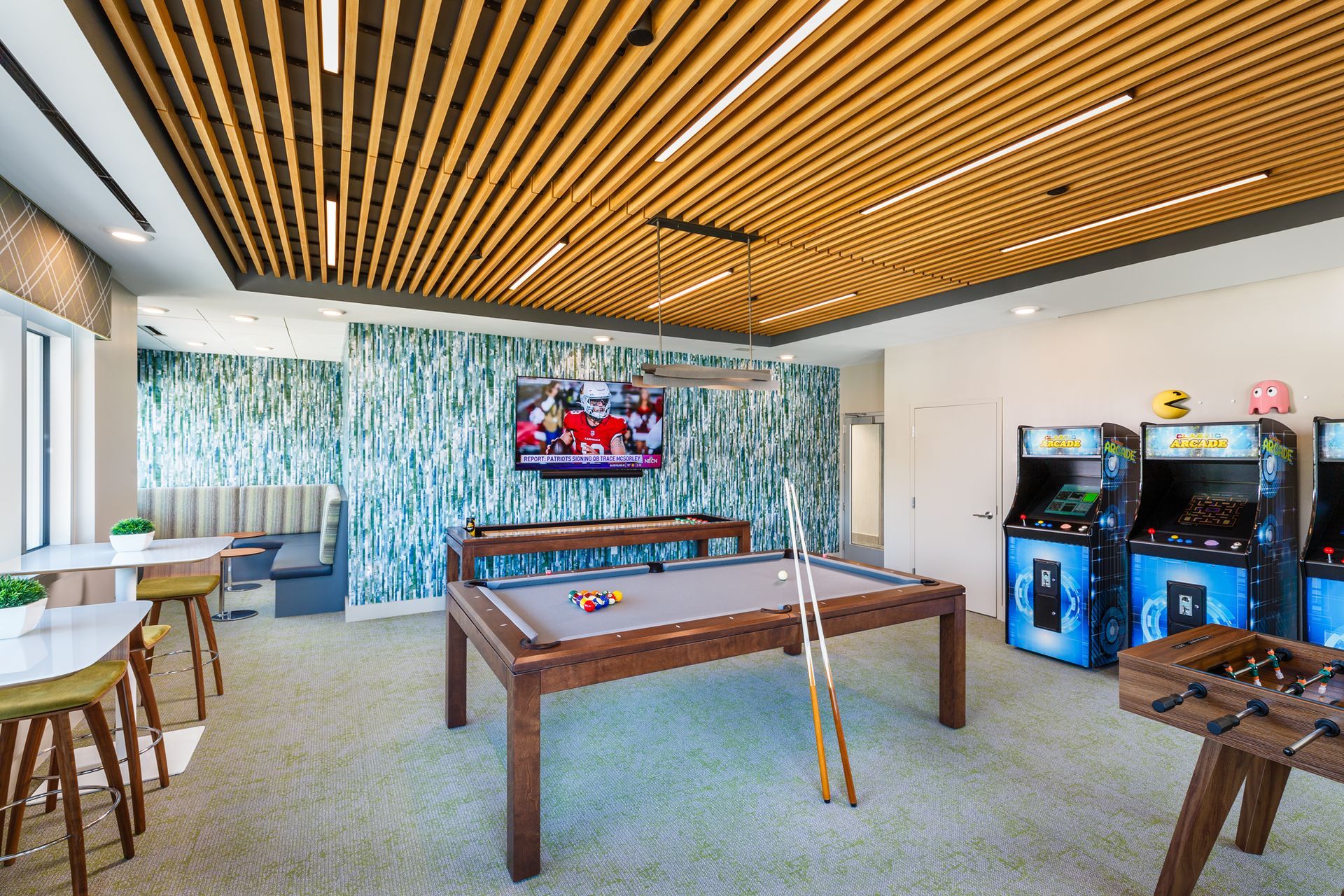 There is a pool table in the middle of the room.
