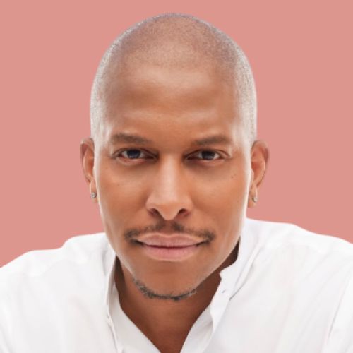A close up of a man 's face with a pink background