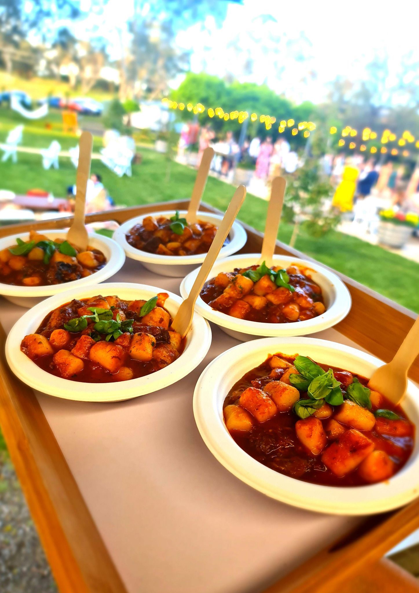 Gnocchi Tuscan beef ragu served in bowls at a Pasta Face wedding.